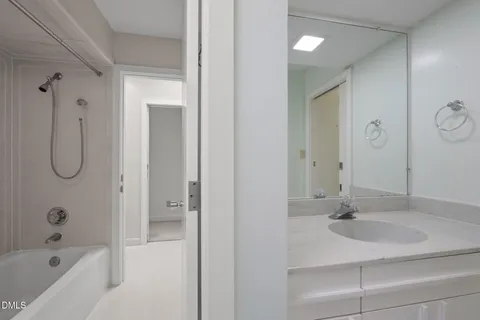 a view of balcony with a floor to ceiling window and kitchen view