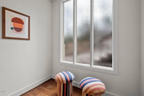 a view of balcony with wooden floor and fence