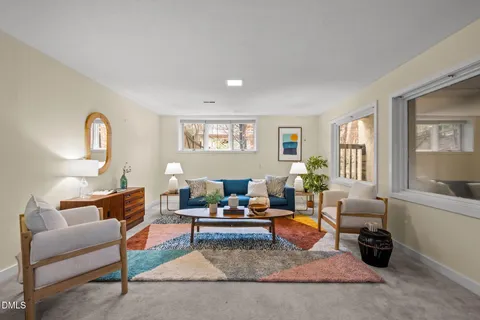 a view of a house with a yard and garage