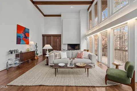 a living room with furniture or couch and a large window