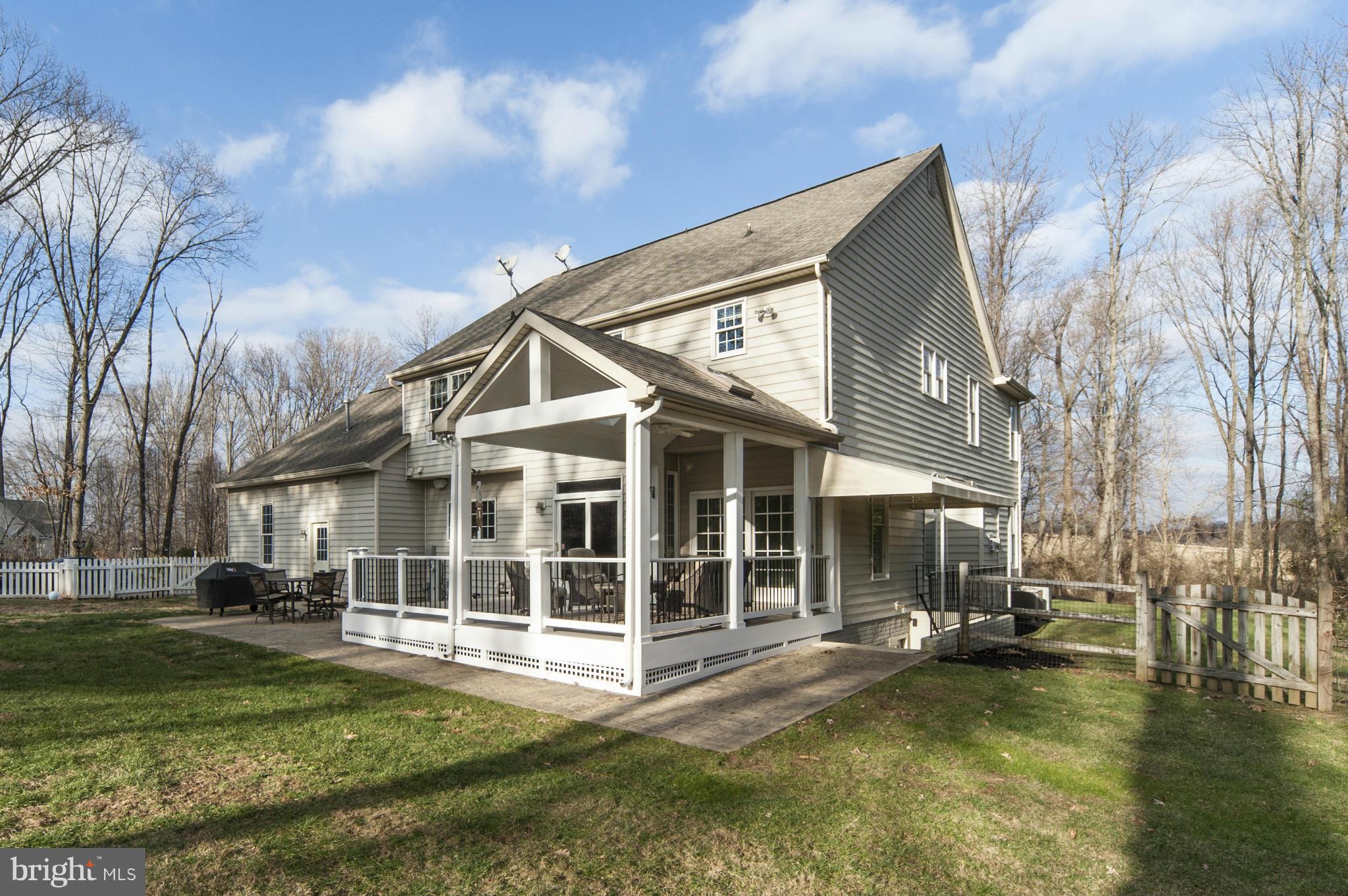 14105 Howard Road Dayton, MD 21036 - Photo 29 of 30 Porch w/skylights/ceiling fan,concrete patio