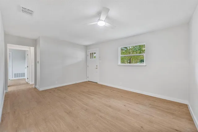 a view of an empty room with a window