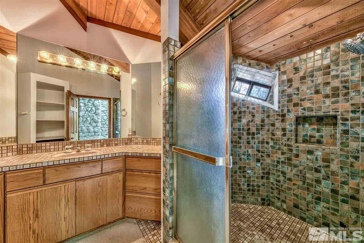 239 Theobald Reno, NV 89521 - Photo 18 of 23 a bathroom with a shower and a sink