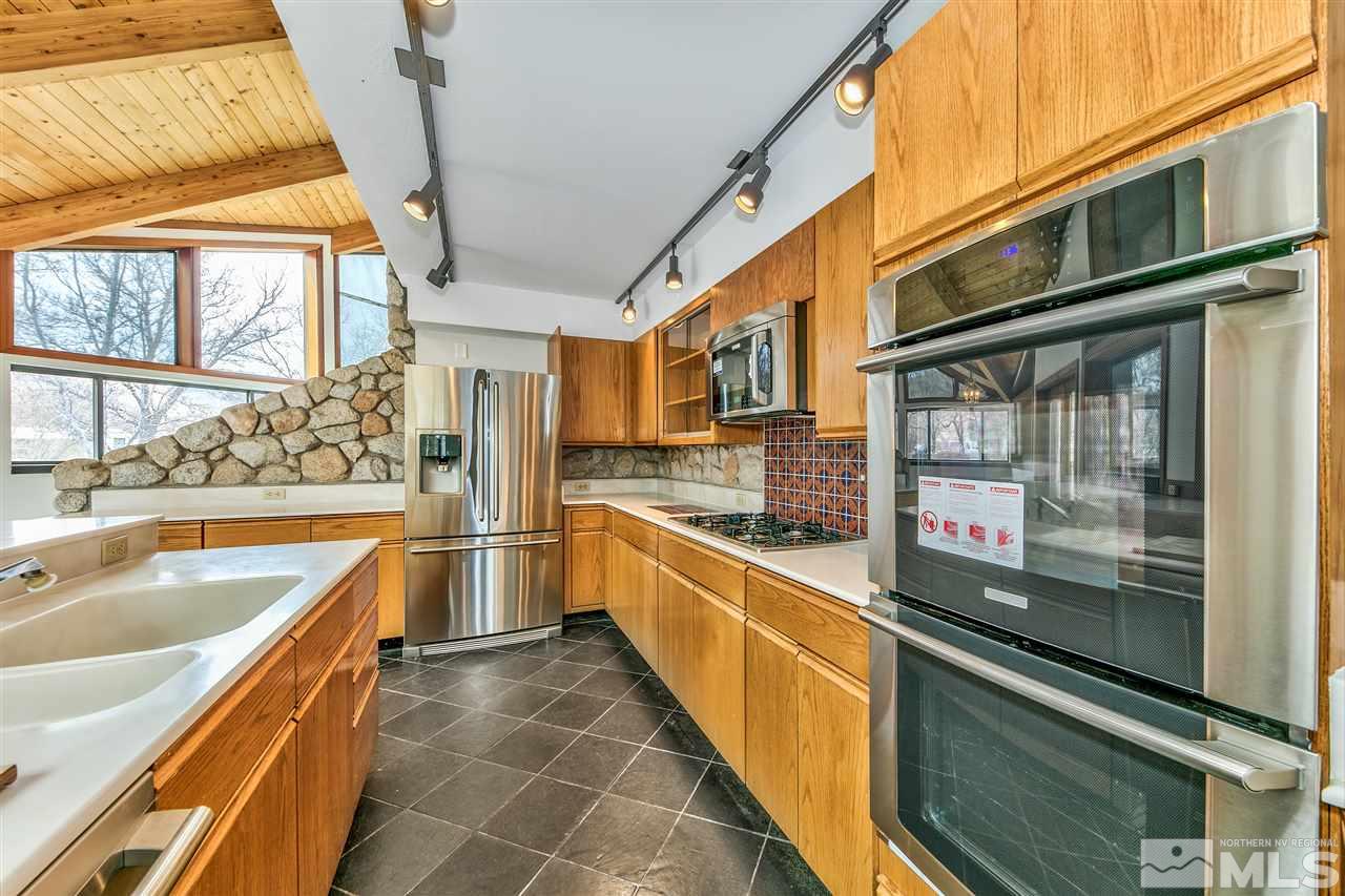 239 Theobald Reno, NV 89521 - Photo 8 of 23 a large kitchen with a large window