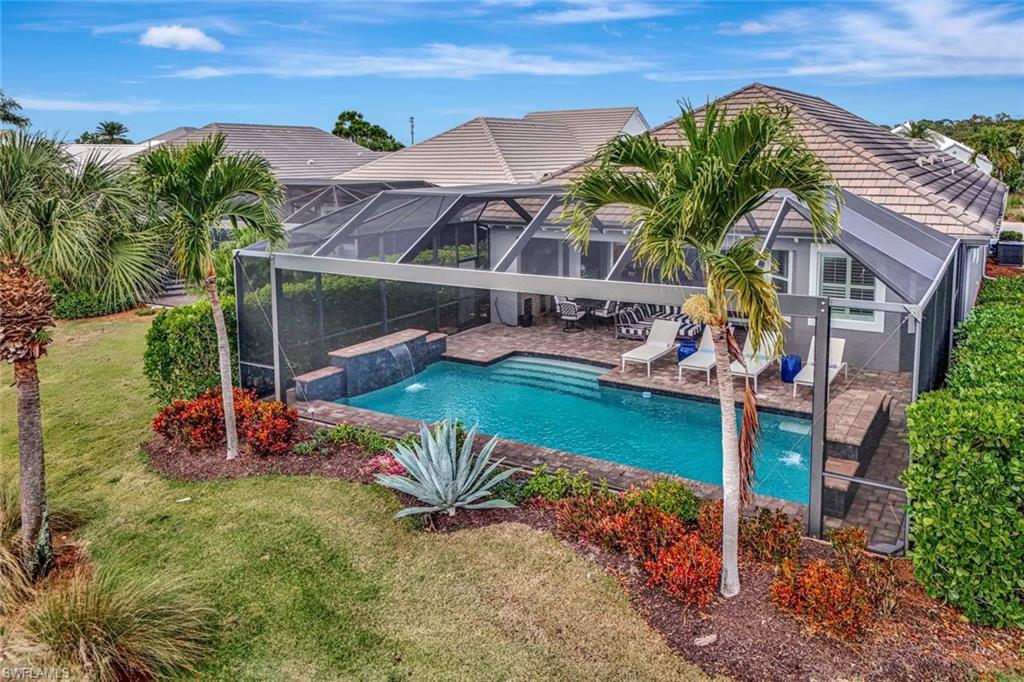 4905 Andros Drive Naples, FL 34113 - Photo 11 of 45 Swimming pool featuring dual waterfalls