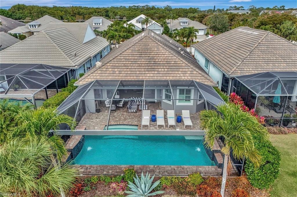 4905 Andros Drive Naples, FL 34113 - Photo 13 of 45 Back of property with patio area pool with panoramic screen for unobstructed views