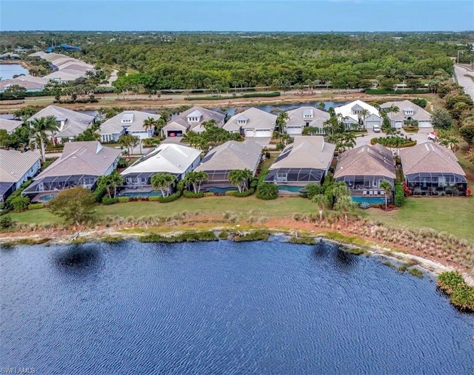 4905 Andros Drive Naples, FL 34113 - Photo 14 of 45 Aerial view of residence from the long lake