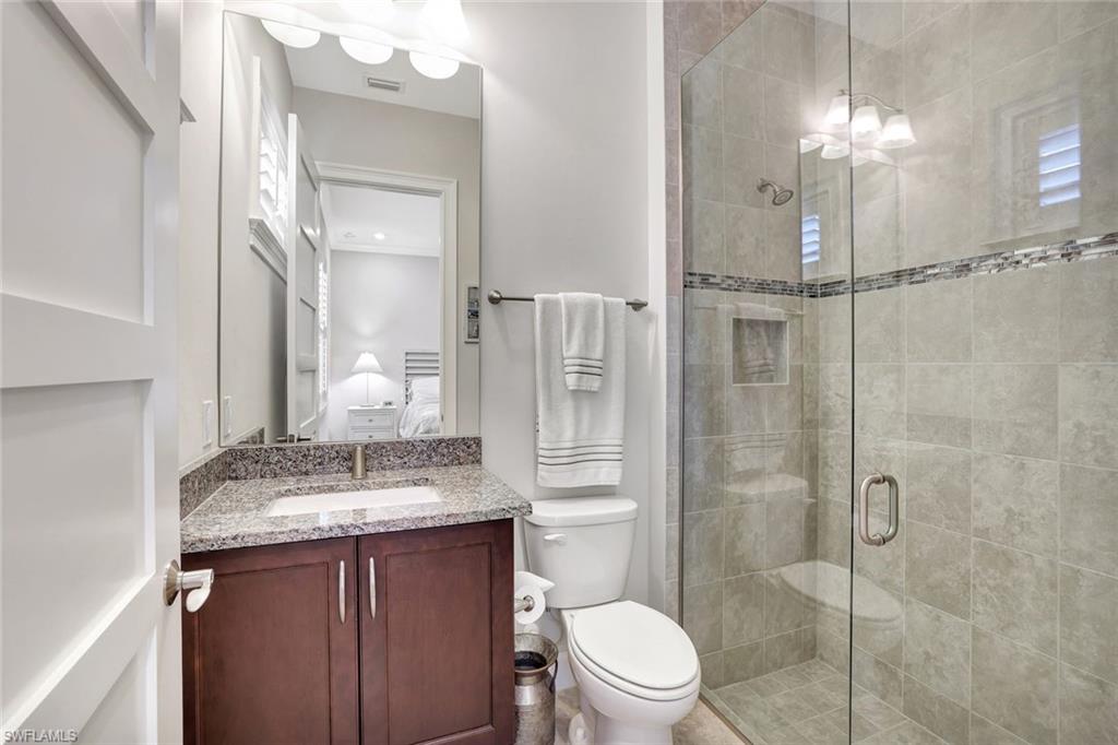 4905 Andros Drive Naples, FL 34113 - Photo 31 of 45 Ensuite bathroom with vanity and a shower stall