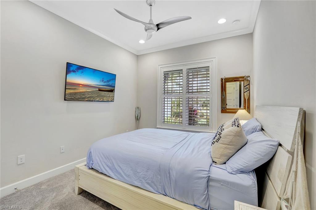 4905 Andros Drive Naples, FL 34113 - Photo 32 of 45 Bedroom featuring carpet, ceiling fan, ornamental molding, and recessed lighting