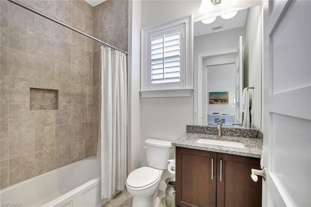 4905 Andros Drive Naples, FL 34113 - Photo 33 of 45 Full bathroom with shower / bath combo and vanity