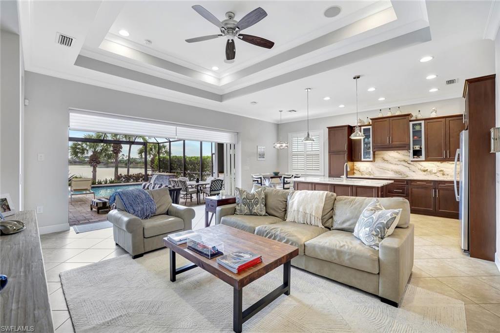4905 Andros Drive Naples, FL 34113 - Photo 37 of 45 Living room with crown molding, ceiling fan, and recessed lighting