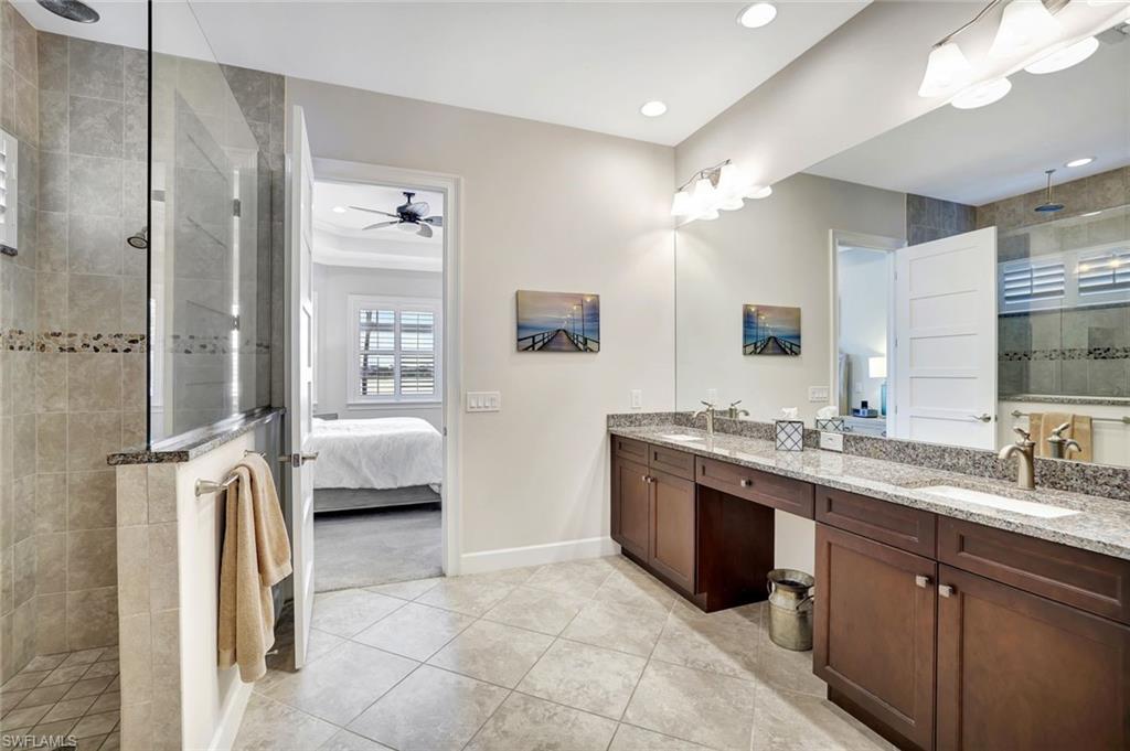 4905 Andros Drive Naples, FL 34113 - Photo 41 of 45 Owners suite bath with walk in shower, double vanity