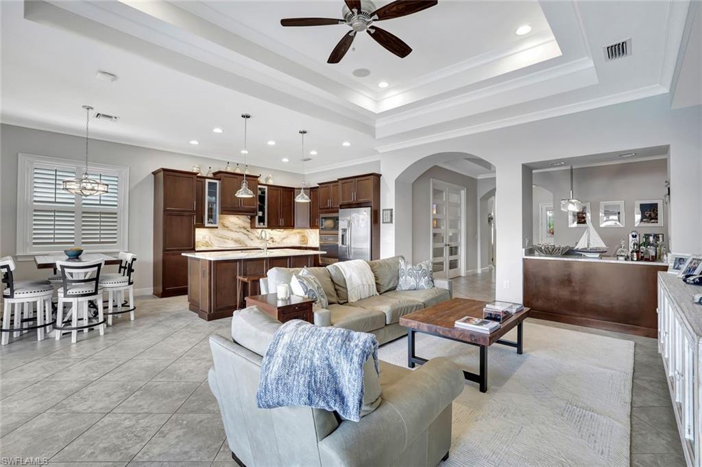 4905 Andros Drive Naples, FL 34113 - Photo 43 of 45 Living room featuring arched walkways, crown molding, recessed lighting, a ceiling fan
