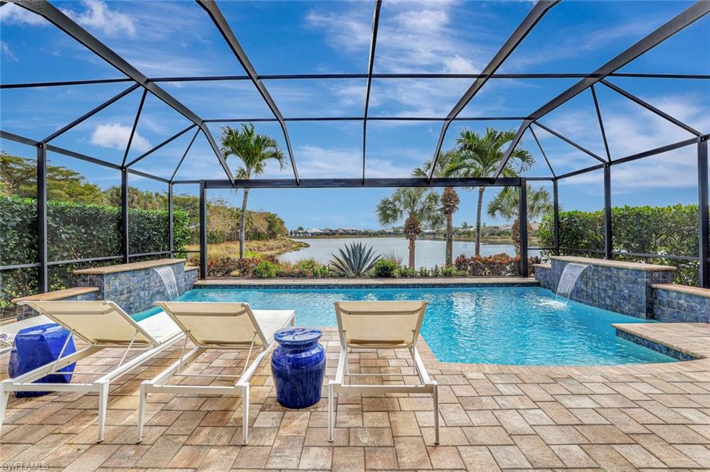 4905 Andros Drive Naples, FL 34113 - Photo 6 of 45 Outdoor pool with a lanai, a patio area, and a water view