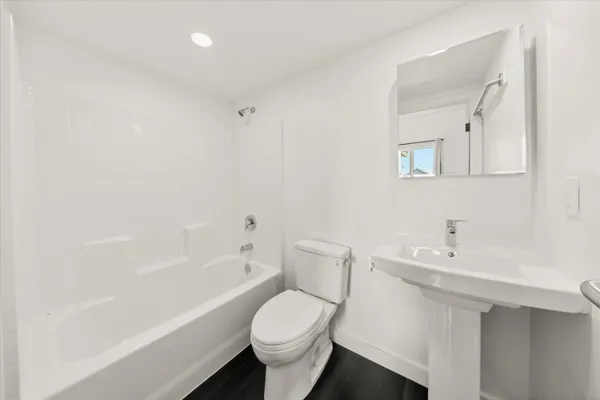 a bathroom with a sink toilet and bathtub