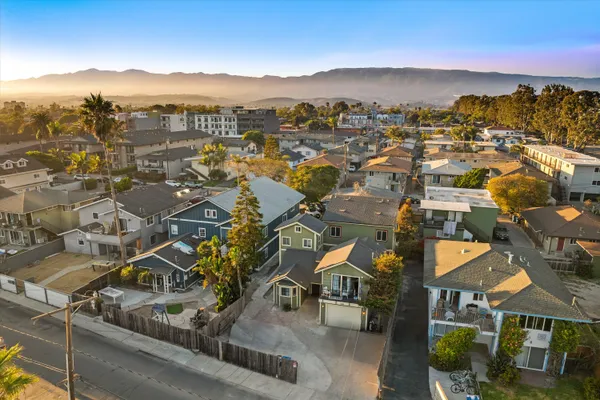 an aerial view of residential houses with outdoor space