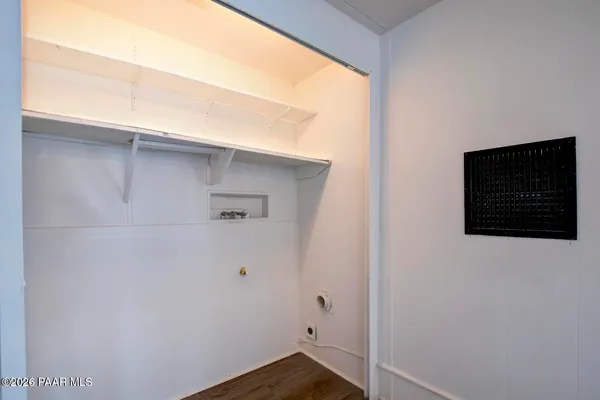 a bedroom with bed and a window