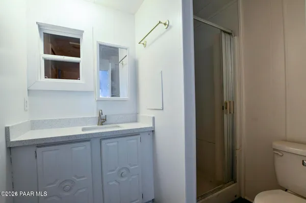 a bed room with two beds and a window