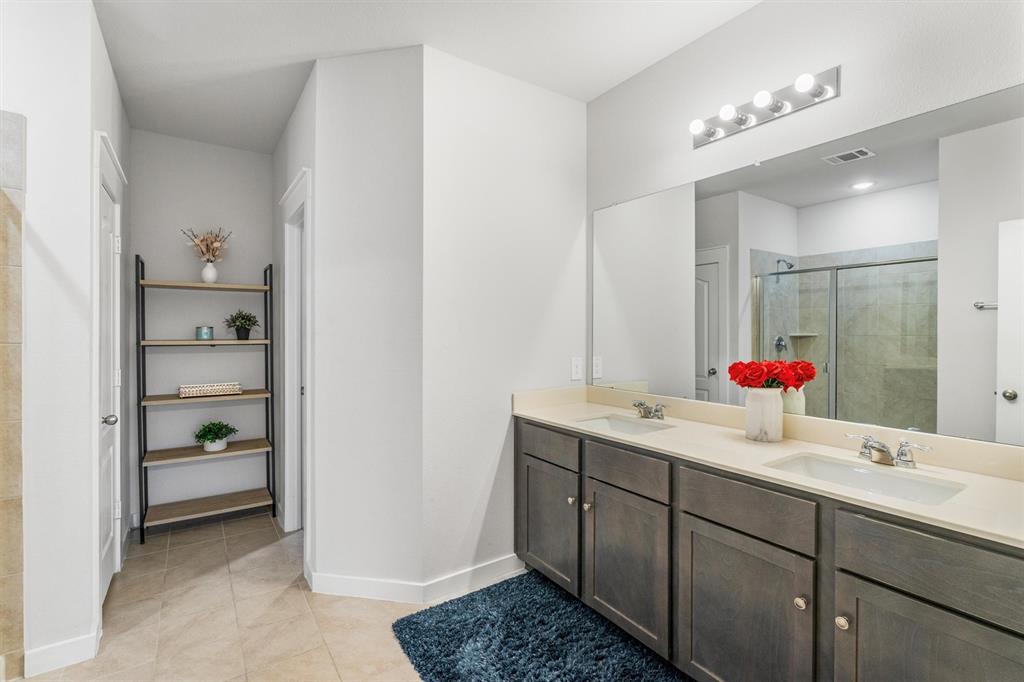 2407 Neff Lane Forney, TX 75126 - Photo 10 of 22 a bathroom with a sink and a mirror