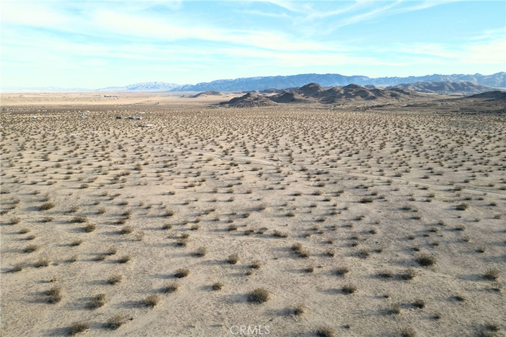 1111 Rainier Road Joshua Tree, CA 92252 - Photo 3 of 12 a view of lake with mountain view