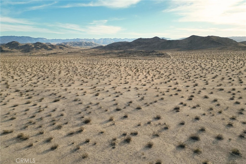 1111 Rainier Road Joshua Tree, CA 92252 - Photo 10 of 12 a view of a lake with mountain