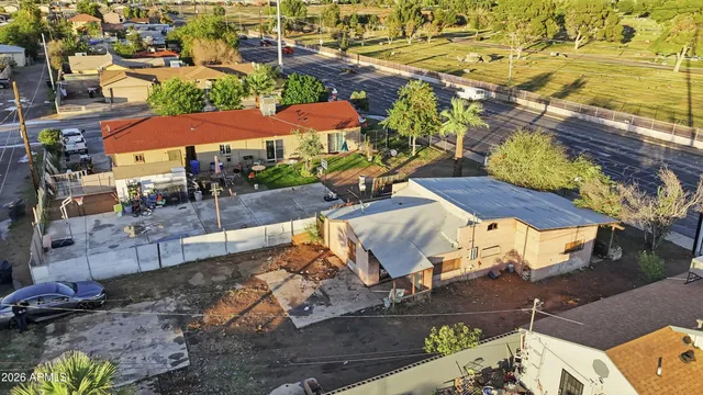 an aerial view of residential houses with outdoor space