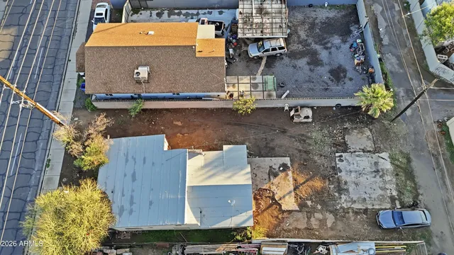 an aerial view of a house with a ocean view
