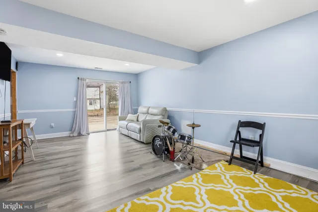 a living room with furniture and a rug