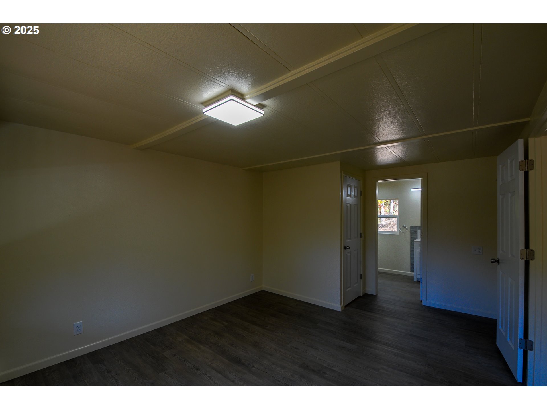 2193 Canyonville-Riddle Road Riddle, OR 97469 - Photo 20 of 25 a view of empty room with wooden floor