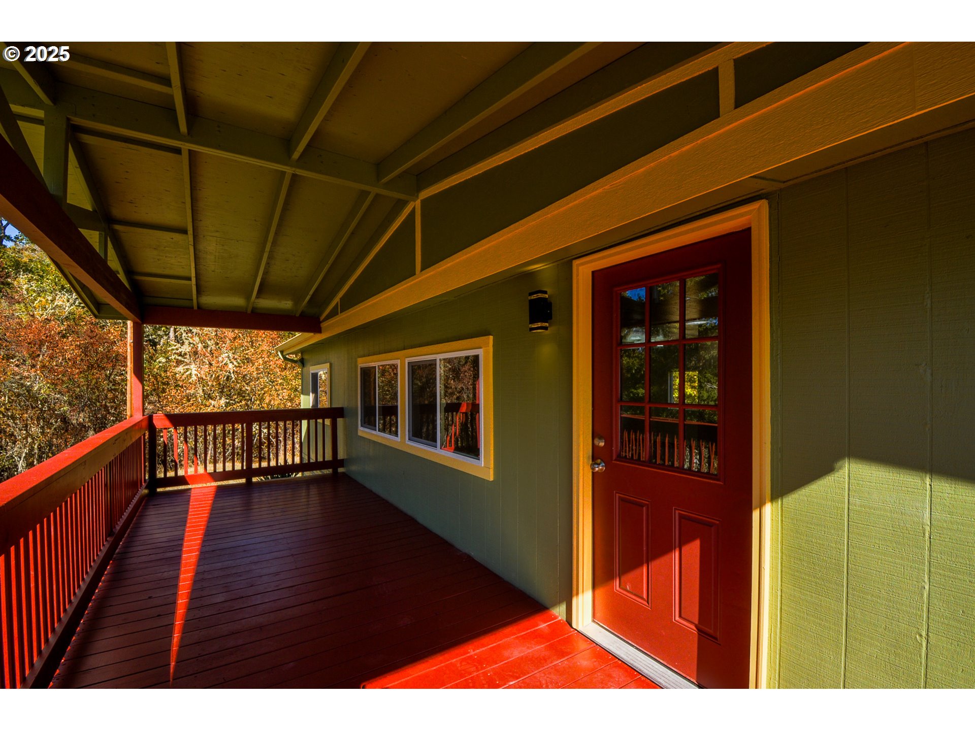 2193 Canyonville-Riddle Road Riddle, OR 97469 - Photo 6 of 25 a view of an empty room with wooden floor and a window