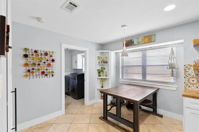 a view of a livingroom with furniture and window