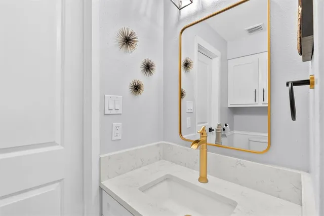 a bathroom with a sink and a shower