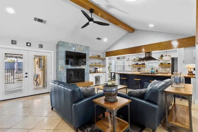a living room with fireplace furniture and a flat screen tv