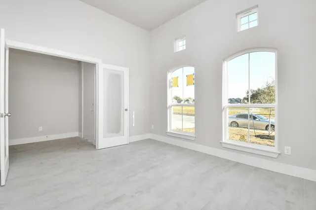 an empty room with windows