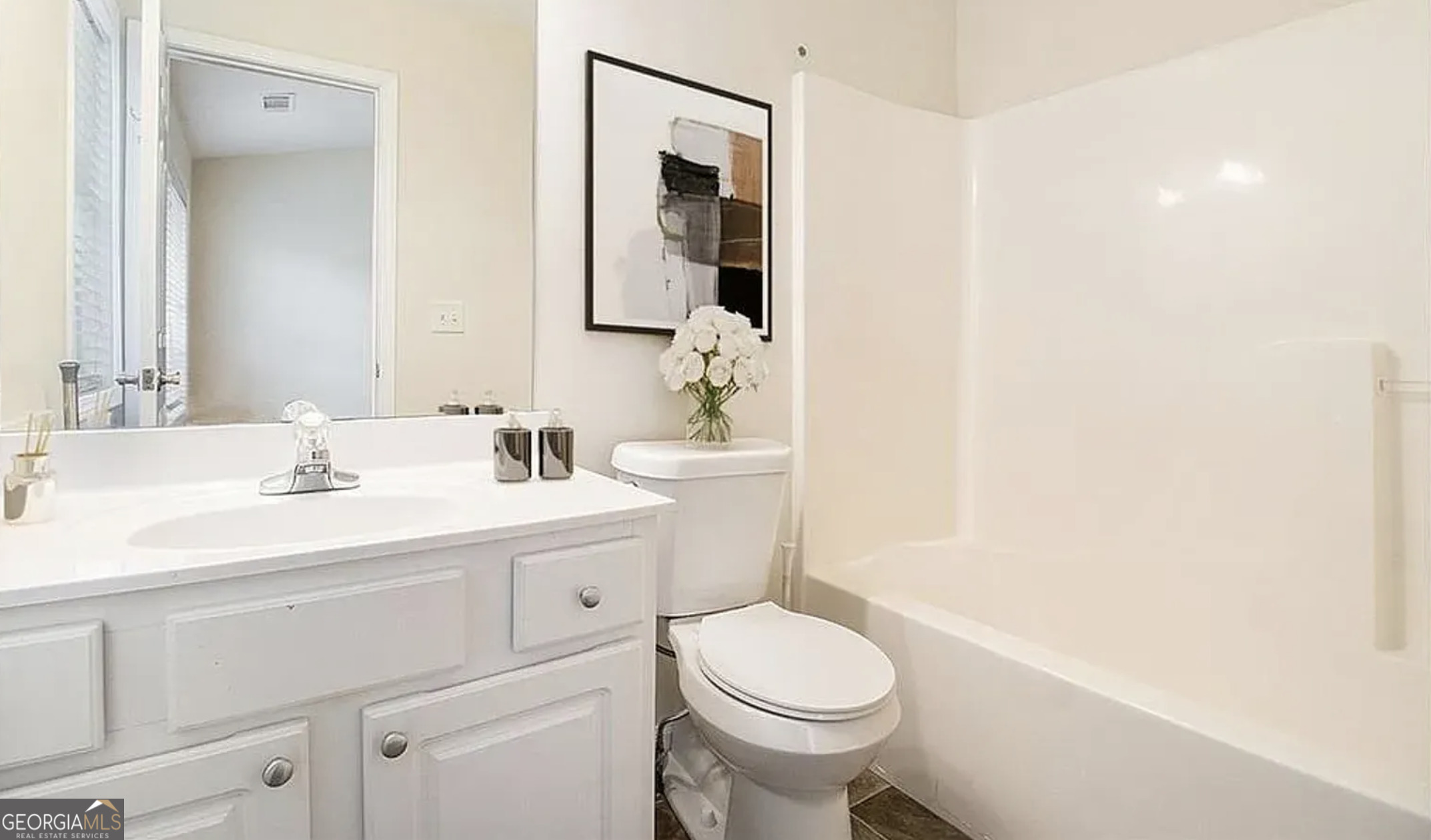 3068 Lauren Parc Road Decatur, GA 30032 - Photo 11 of 13 a bathroom with a sink a toilet a mirror and vanity