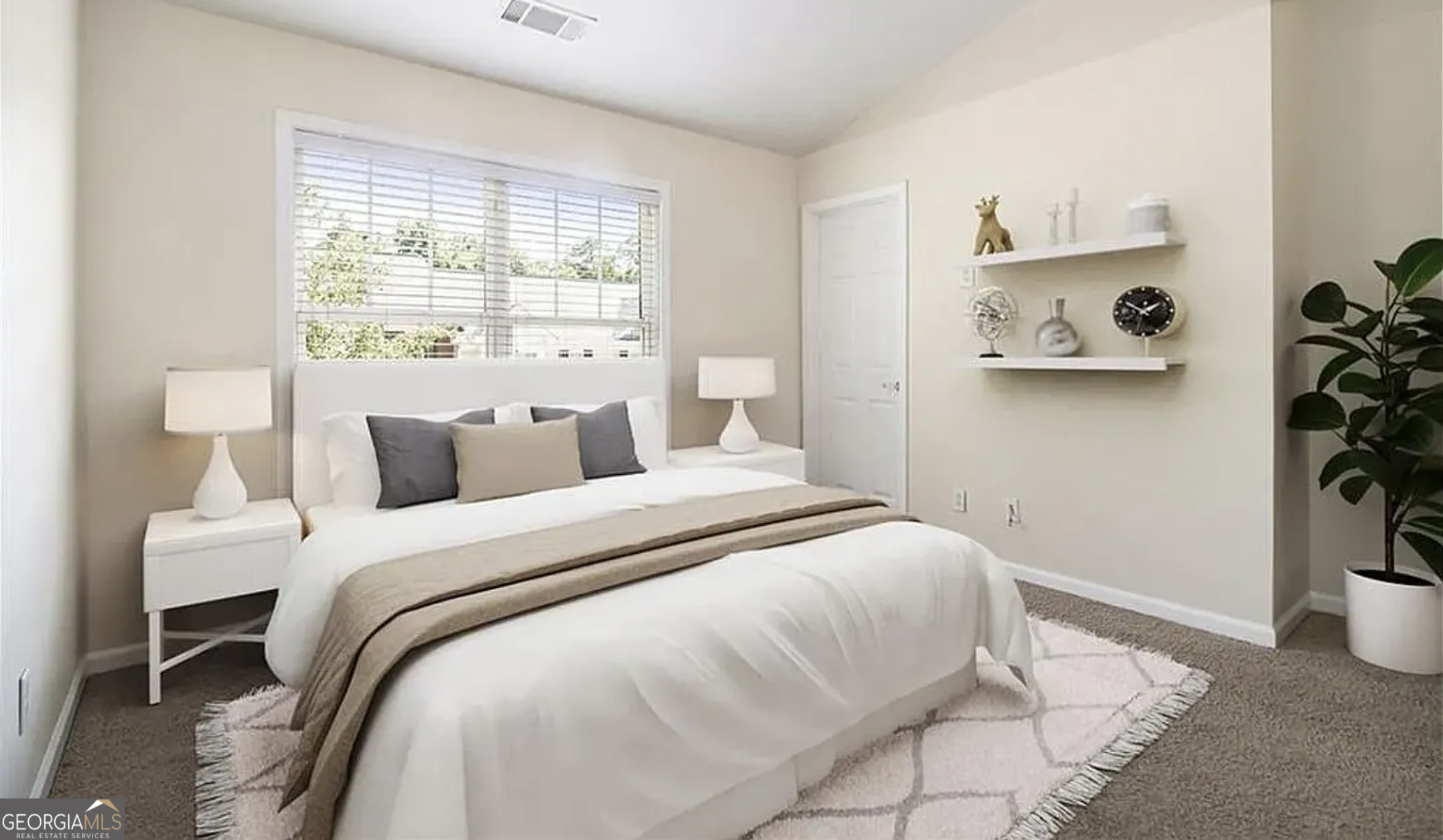 3068 Lauren Parc Road Decatur, GA 30032 - Photo 7 of 13 a bedroom with a bed and painting on the wall