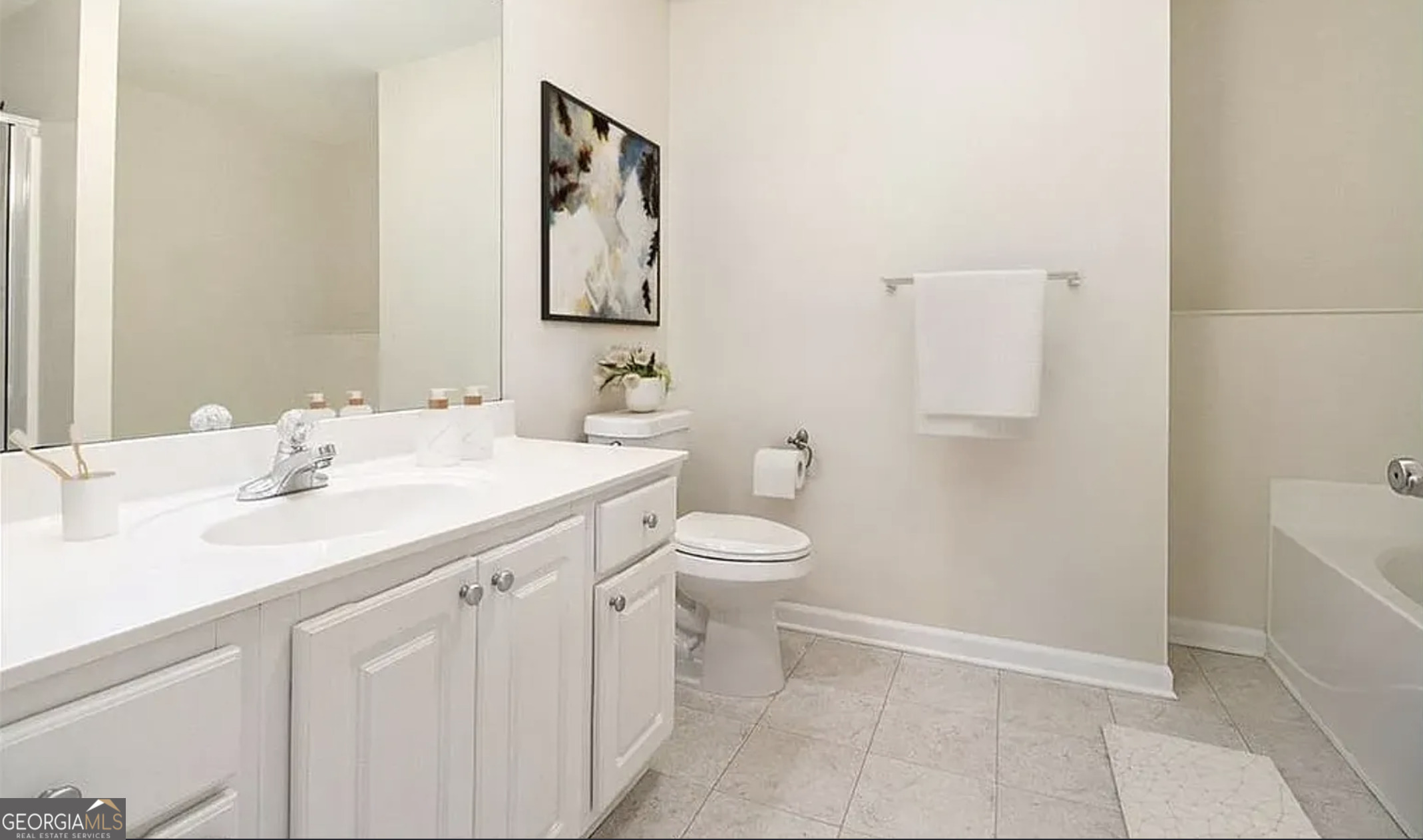 3068 Lauren Parc Road Decatur, GA 30032 - Photo 8 of 13 a bathroom with a sink a toilet and mirror