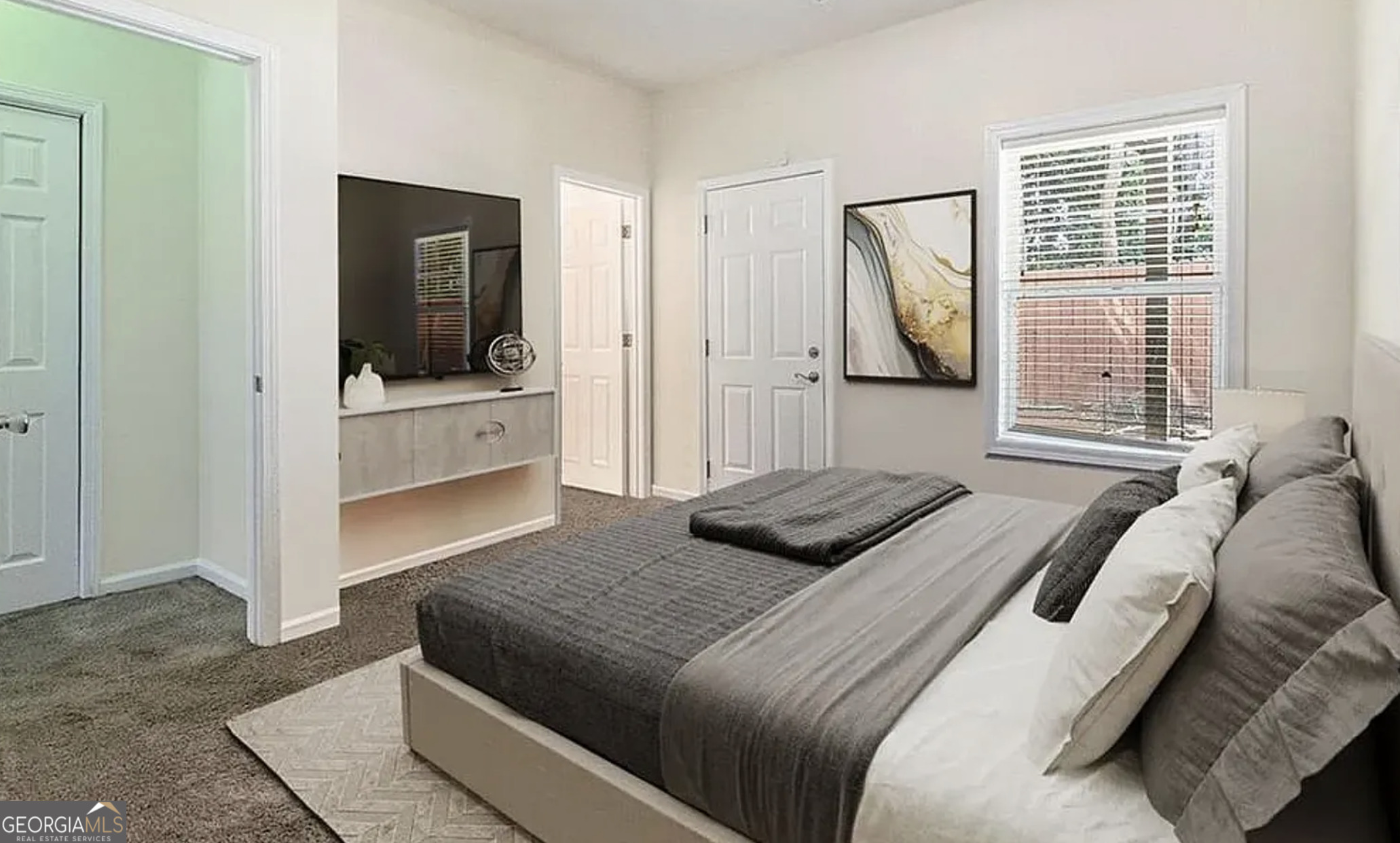 3068 Lauren Parc Road Decatur, GA 30032 - Photo 9 of 12 a bedroom with a bed and a television