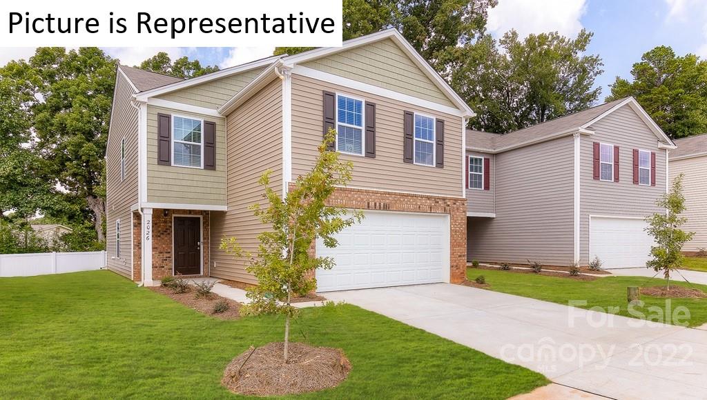 5023 Fandango Road York, SC 29745 - Photo 2 of 30 a front view of a house with a yard and garage