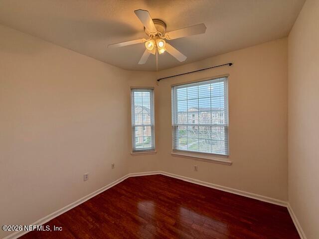 7990 Baymeadows Road East, Unit 928 Jacksonville, FL 32256 - Photo 16 of 30 an empty room with wooden floor and windows