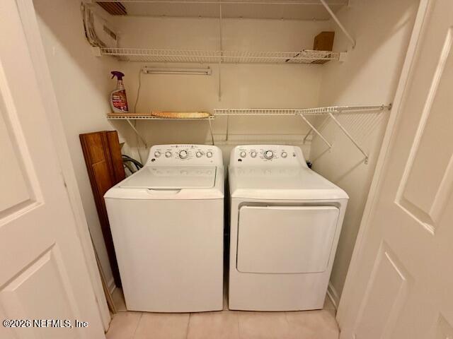 7990 Baymeadows Road East, Unit 928 Jacksonville, FL 32256 - Photo 22 of 30 a utility room with dryer and washer