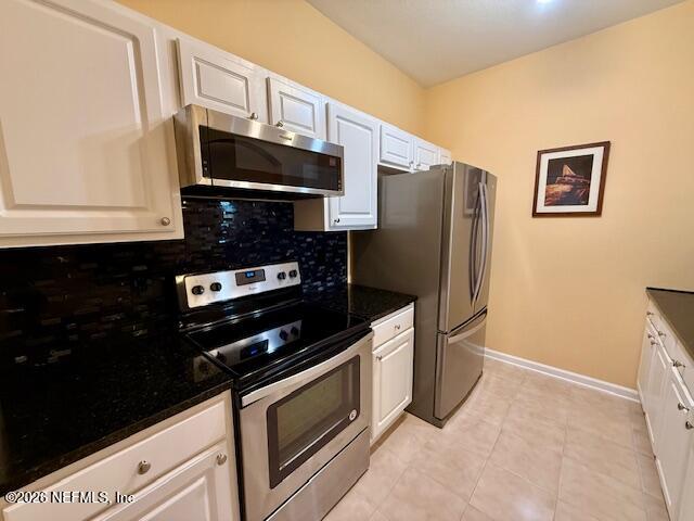 7990 Baymeadows Road East, Unit 928 Jacksonville, FL 32256 - Photo 5 of 30 a kitchen with granite countertop cabinets and steel stainless steel appliances