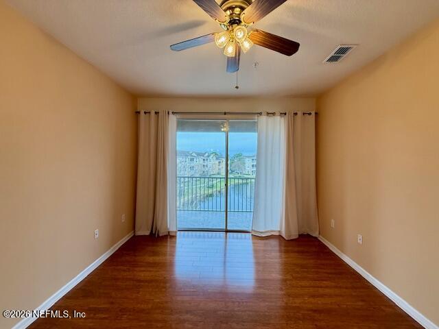 7990 Baymeadows Road East, Unit 928 Jacksonville, FL 32256 - Photo 10 of 30 wooden floor in an empty room with a window