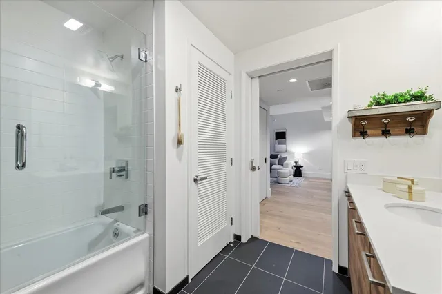 a bathroom with a sink and shower