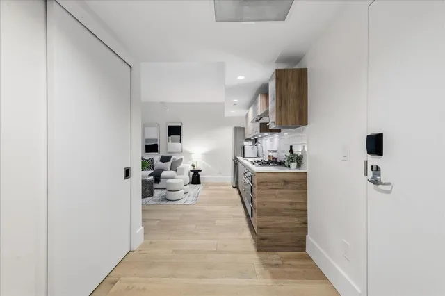 a bathroom with a sink a mirror and shower