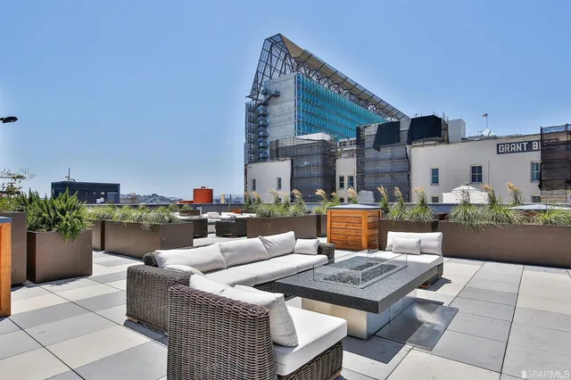 a outdoor space with patio furniture and potted plants