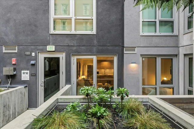 front view of a brick house with a large window