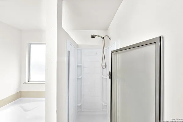 a white bath tub sitting in a bathroom