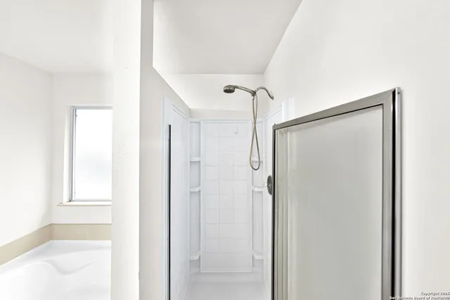 a white bath tub sitting in a bathroom