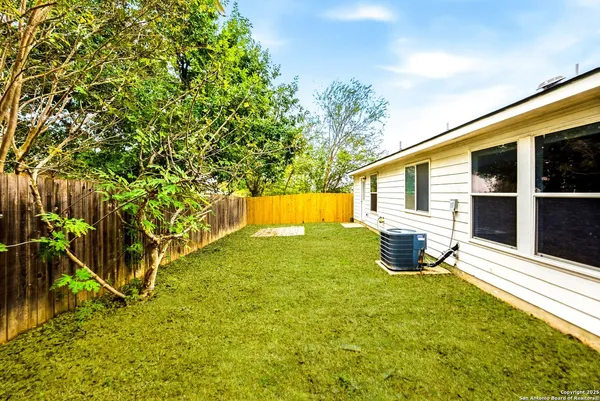 a view of a backyard of the house
